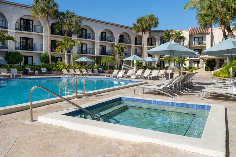 Outdoor jacuzzi and pool in a courtyard